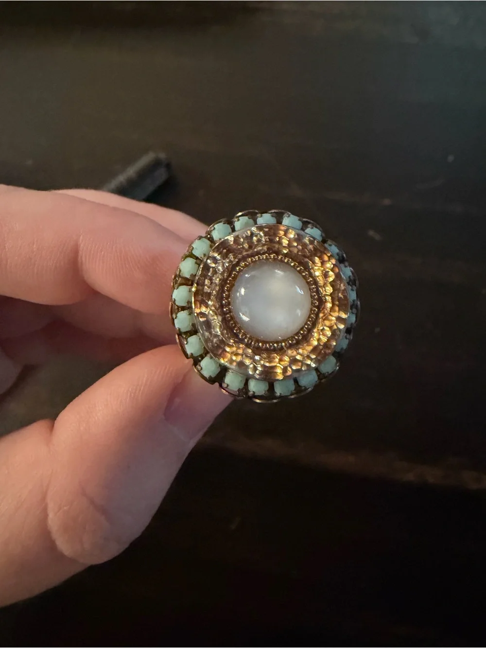 White cats eye cabochon and turquoise ring